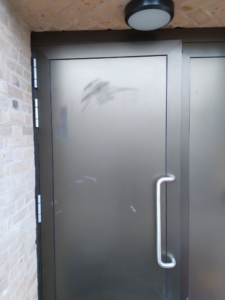 black door with scratches