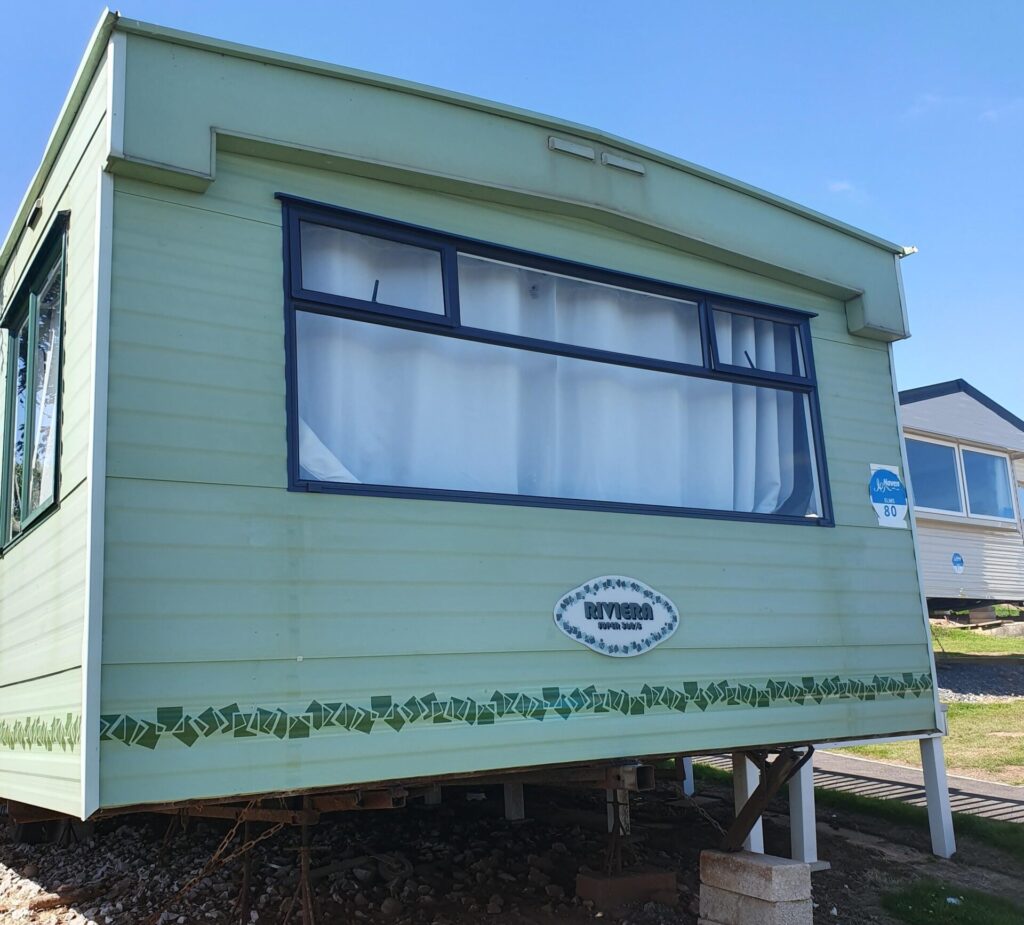 back of a caravan in green