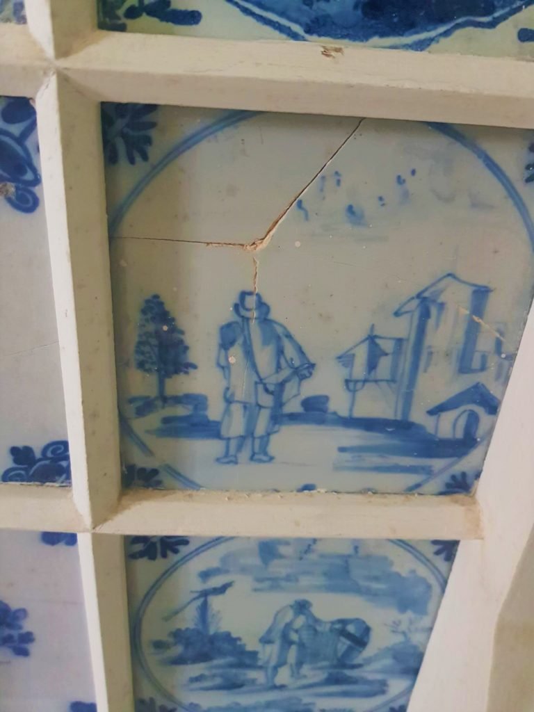 blue painted tiles with crack down the middle