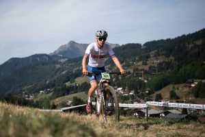 Huw Buck Jones cycling over grass verge